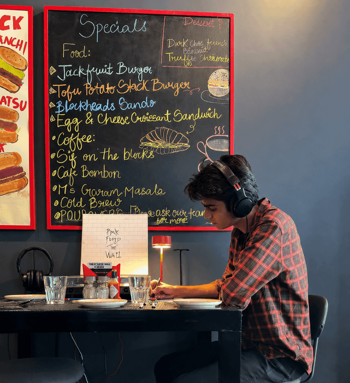 A wall panel at Blockheads reading “But have you heard it on vinyl?”