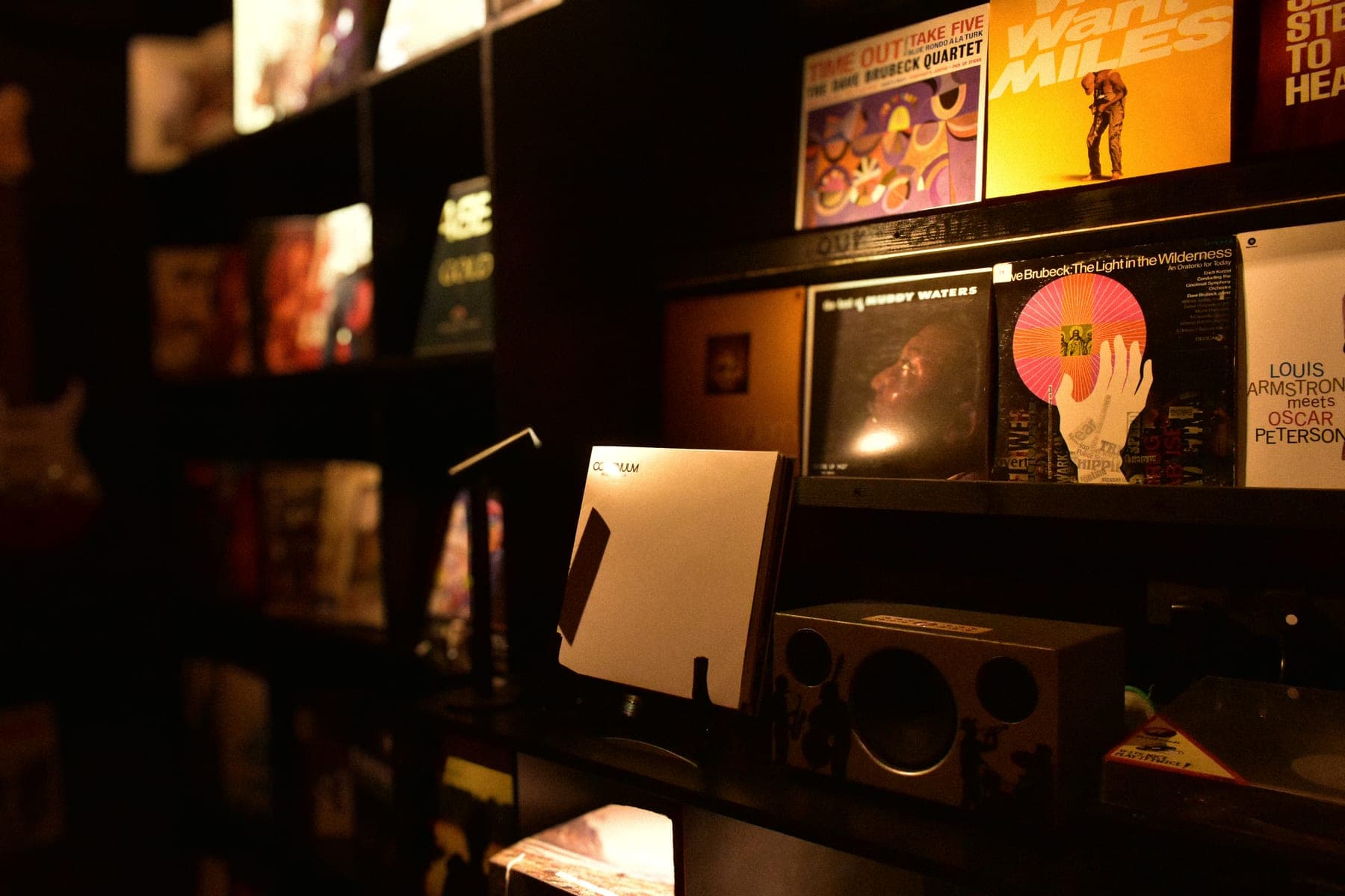 The wall of records that lines the room